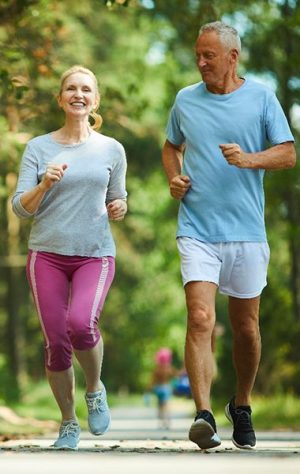 elderly couple jogging in the morning